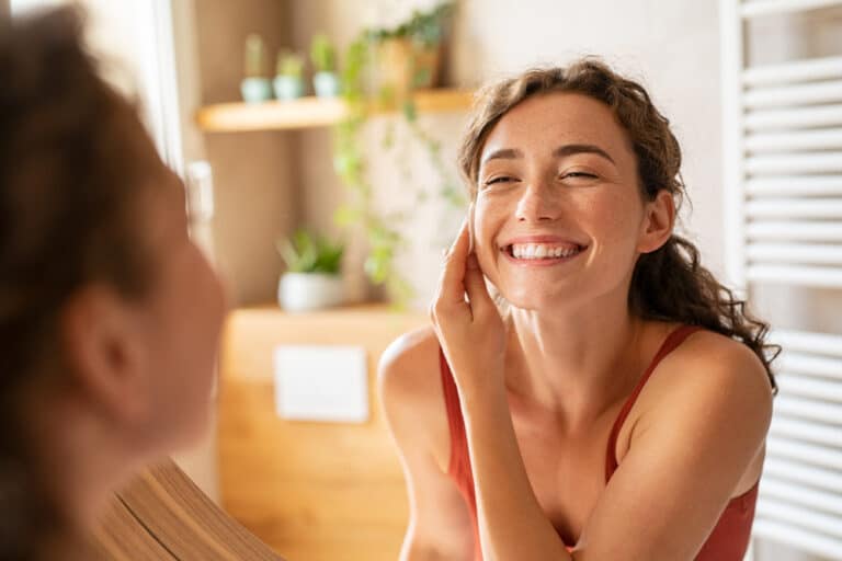 Happy,Smiling,Beautiful,Girl,Cleaning,Skin,Face,With,Cotton,Pad.